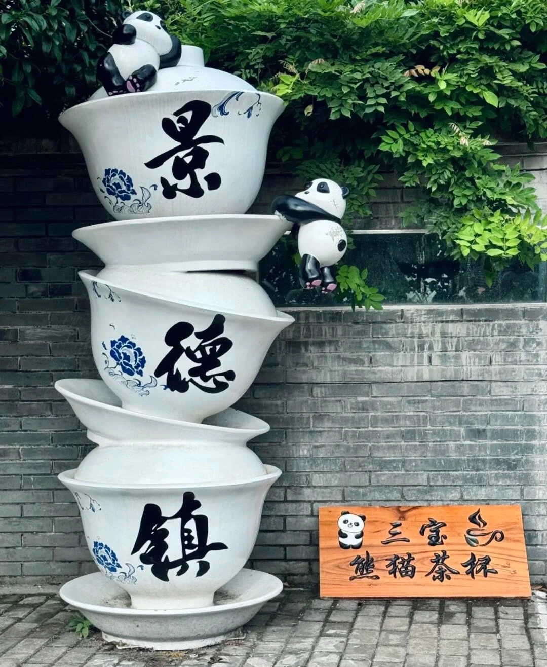 Sanbao Village Ceramic Art Installation Stacked porcelain bowls with panda sculptures symbolize playful traditional craft creativity - Where to Stay in Jingdezhen: Best Areas & Hotels 2026 - The China Journey Sanbao Village Ceramic Art Installation Stacked porcelain bowls with panda sculptures symbolize playful traditional craft creativity - Where to Stay in Jingdezhen: Best Areas & Hotels 2026 - The China Journey