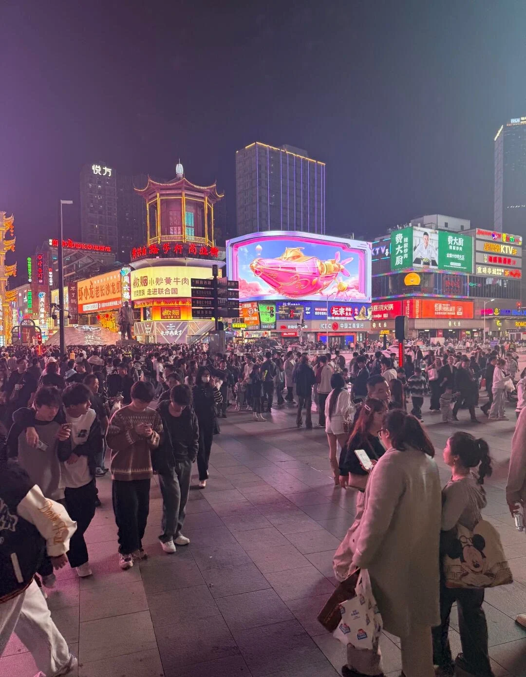 Wuyi Square Changsha Night Crowd Bustling shopping district with neon billboards crowds and vibrant nightlife atmosphere in city center - Where to Stay in Changsha: Best Areas & Hotels 2026 - The China Journey Wuyi Square Changsha Night Crowd Bustling shopping district with neon billboards crowds and vibrant nightlife atmosphere in city center - Where to Stay in Changsha: Best Areas & Hotels 2026 - The China Journey
