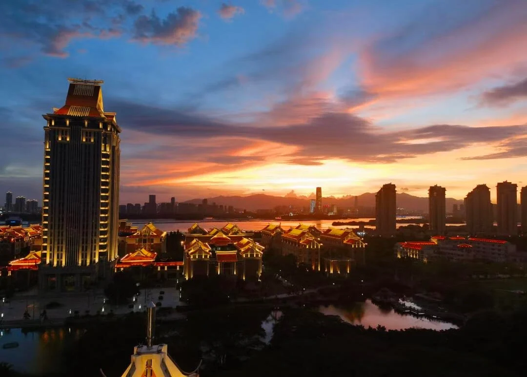 Xiamen Jimei District Sunset Skyline Coastal cityscape with traditional architecture and modern skyline glowing under colorful sunset sky - Where to Stay in Xiamen: Best Areas & Hotels 2026 - The China Journey Xiamen Jimei District Sunset Skyline Coastal cityscape with traditional architecture and modern skyline glowing under colorful sunset sky - Where to Stay in Xiamen: Best Areas & Hotels 2026 - The China Journey
