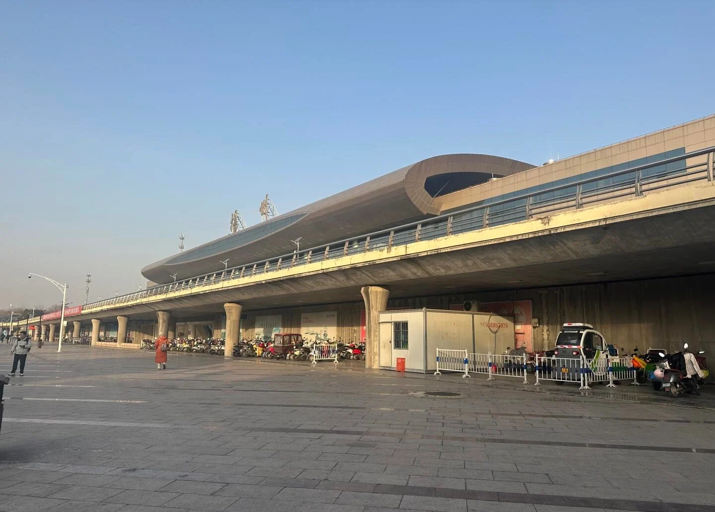 Yangzhou Railway Station Exterior Modern elevated station building with wide plaza and urban transport hub setting - Where to Stay in Yangzhou: Best Areas & Hotels 2026 - The China Journey Yangzhou Railway Station Exterior Modern elevated station building with wide plaza and urban transport hub setting - Where to Stay in Yangzhou: Best Areas & Hotels 2026 - The China Journey