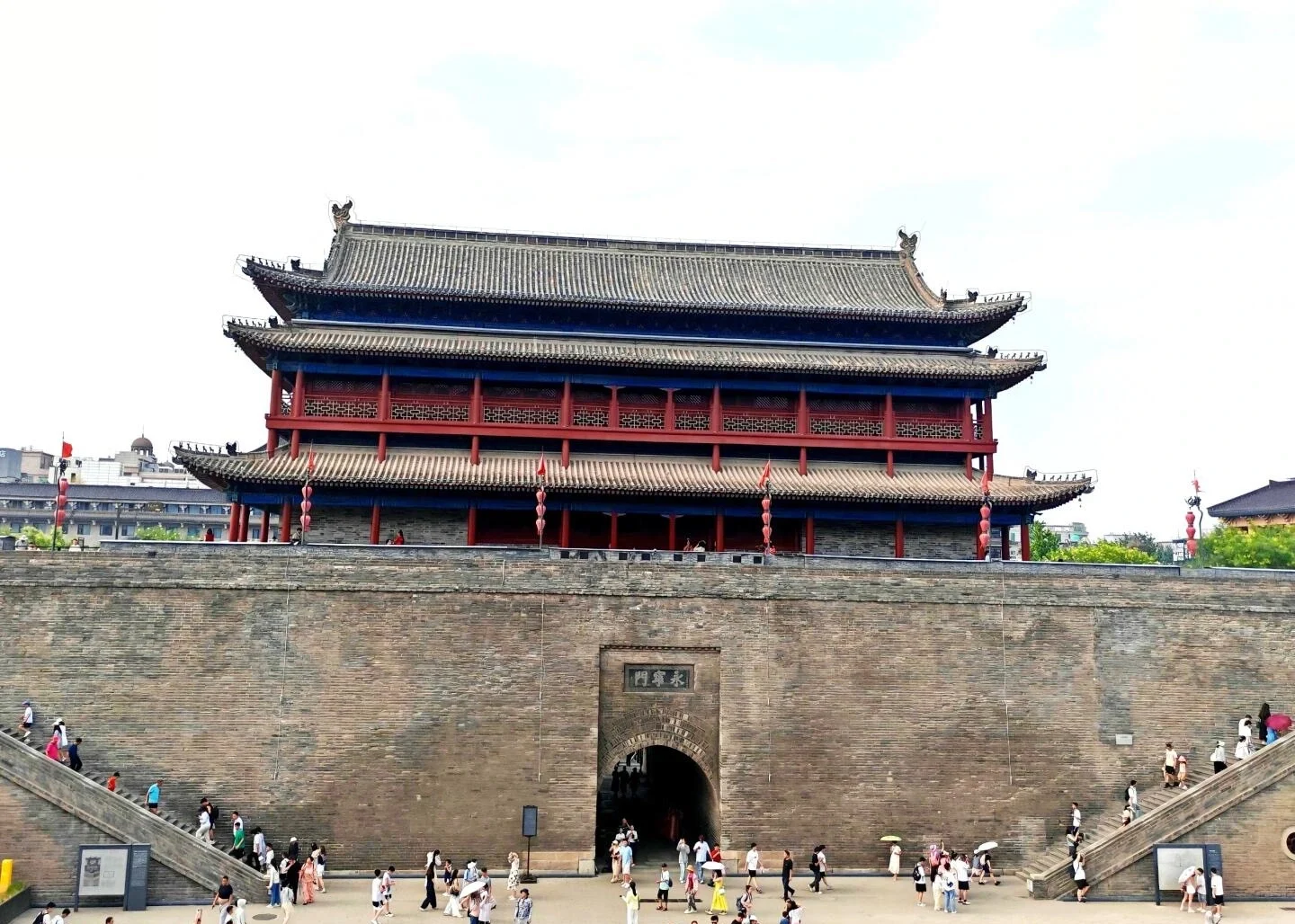 Yongning Gate Xian City Wall Historic Ming dynasty gate with ancient walls and visitors exploring iconic landmark - Where to Stay in Xi’an: Best Areas & Hotels 2026 - The China Journey Yongning Gate Xian City Wall Historic Ming dynasty gate with ancient walls and visitors exploring iconic landmark - Where to Stay in Xi’an: Best Areas & Hotels 2026 - The China Journey