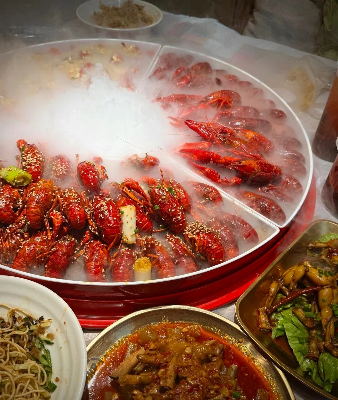 Wuhan Crayfish Spicy crayfish feast with side dishes and smoky table presentation - What to Eat in Wuhan: Local Food Guide 2026 - The China Journey Wuhan Crayfish Spicy crayfish feast with side dishes and smoky table presentation - What to Eat in Wuhan: Local Food Guide 2026 - The China Journey